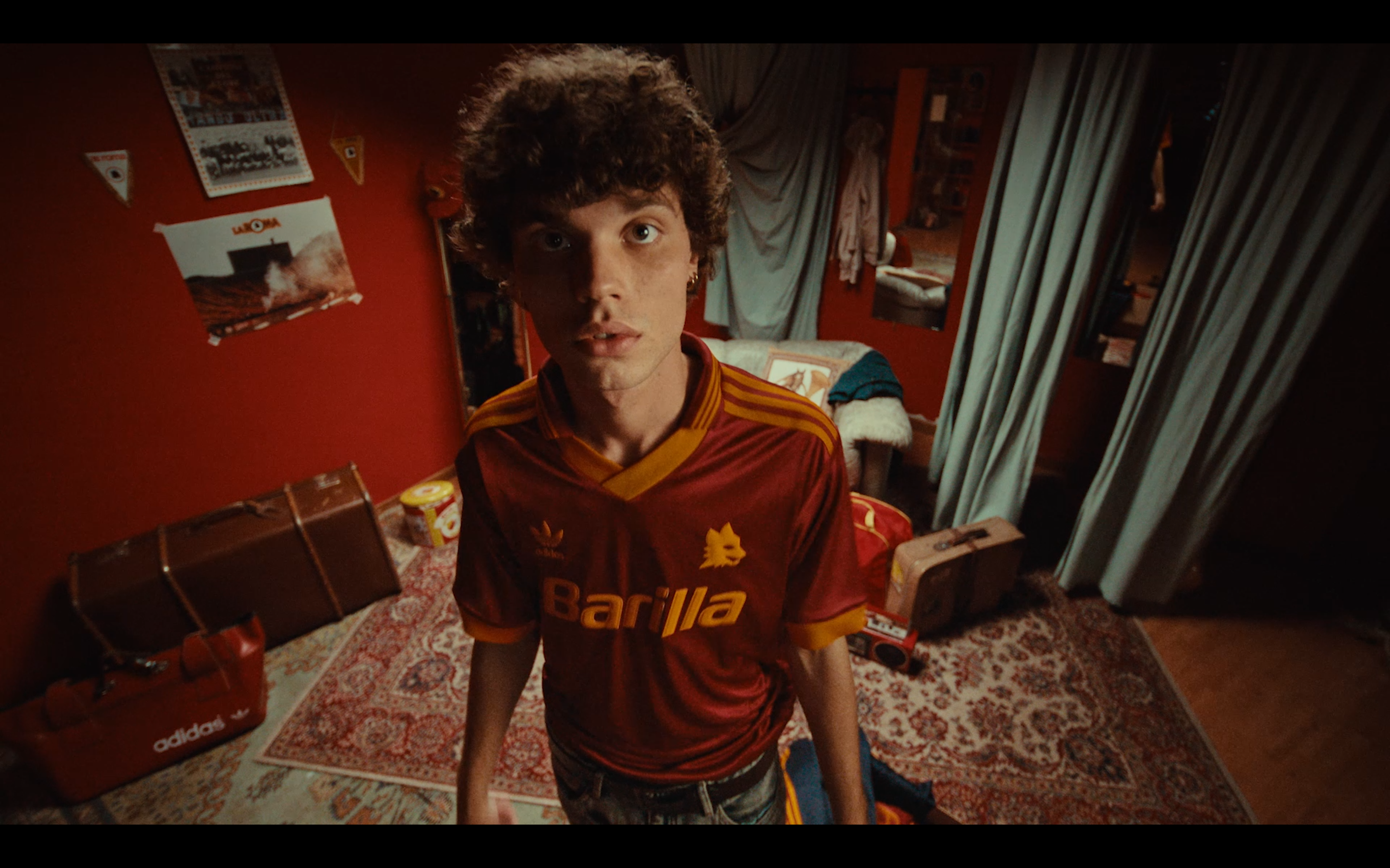 An overhead portrait in an AS Roma jersey