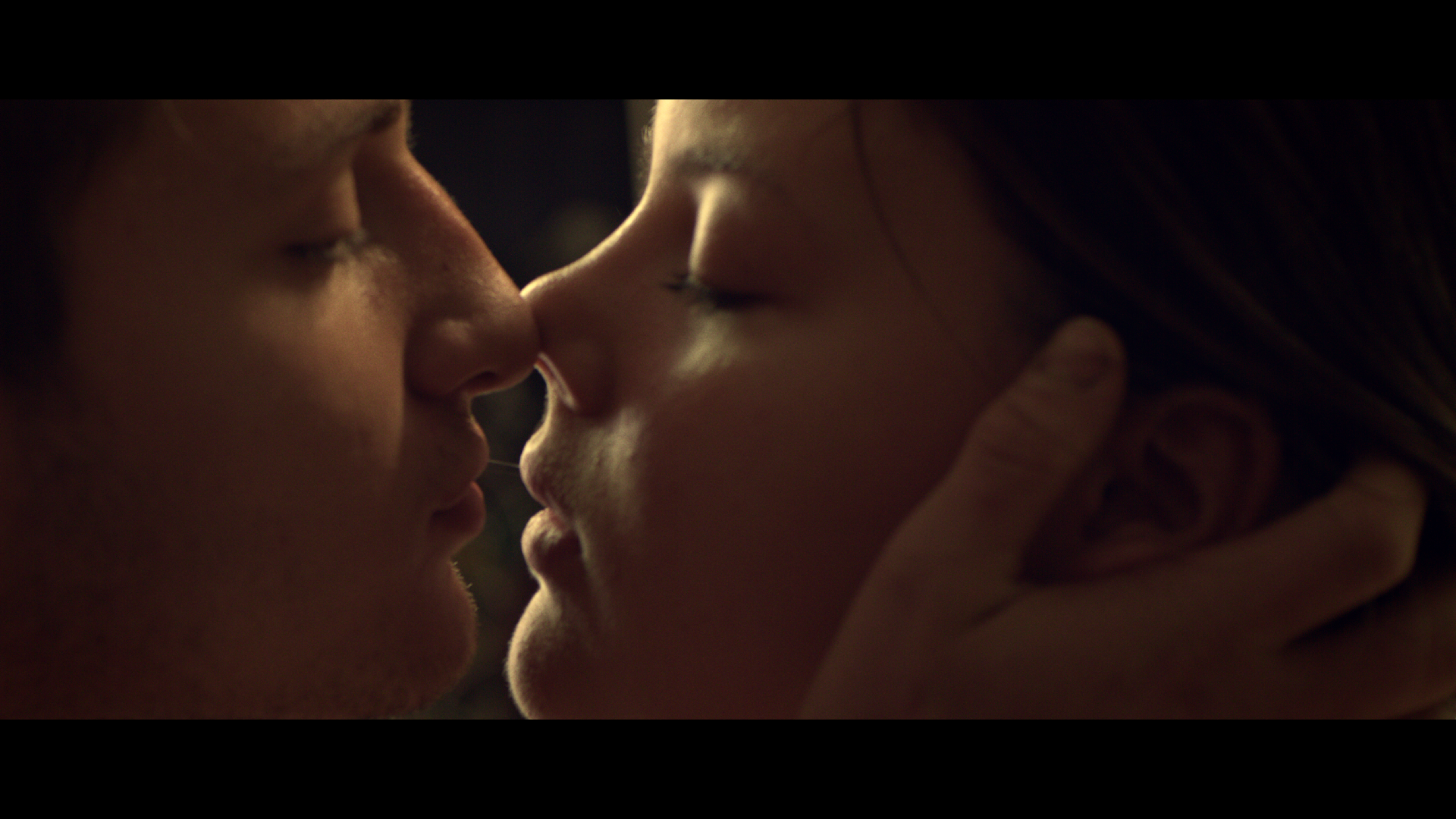 A couple kissing in close-up