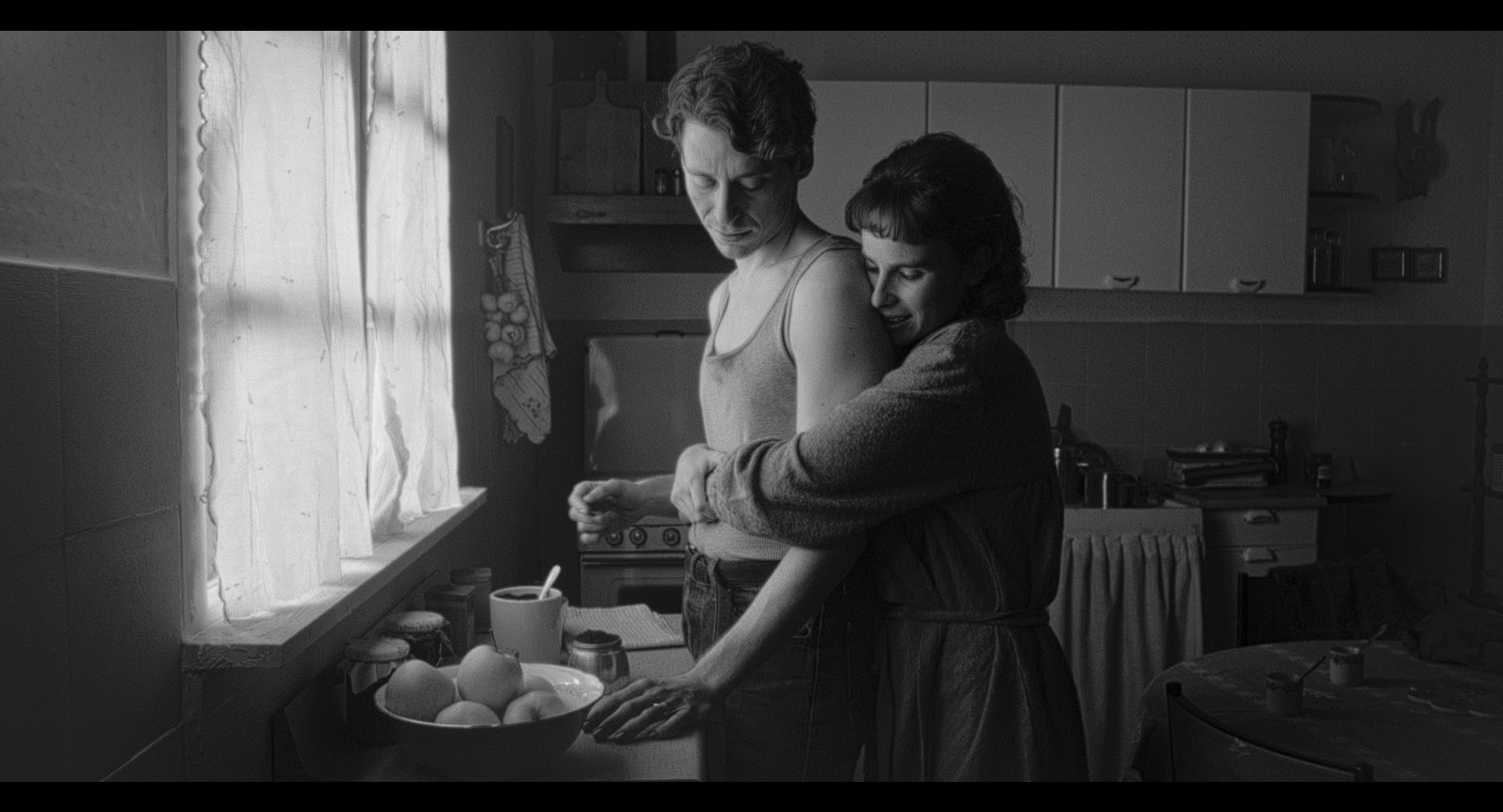 A couple embracing in the kitchen