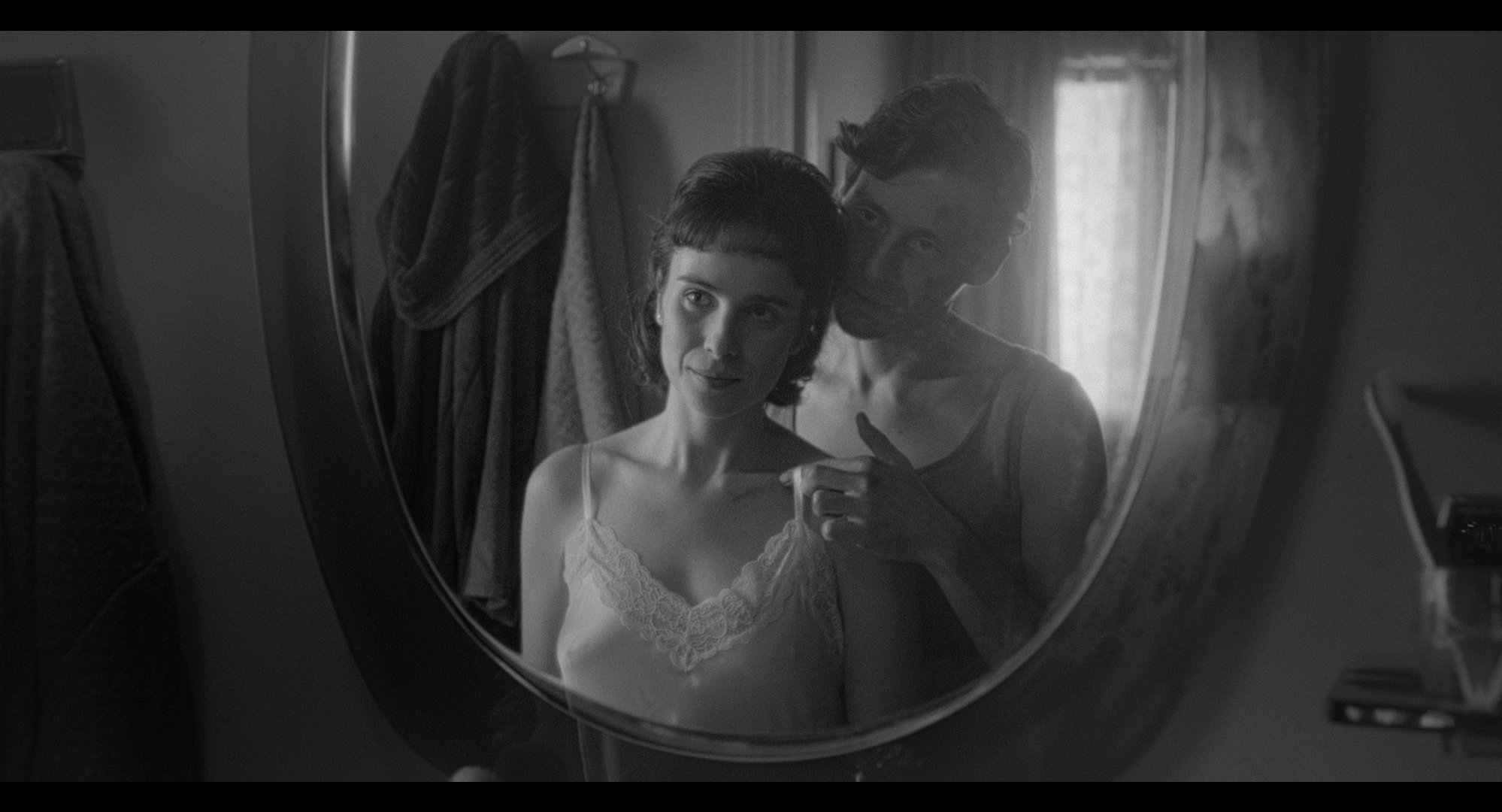A couple reflected in a mirror