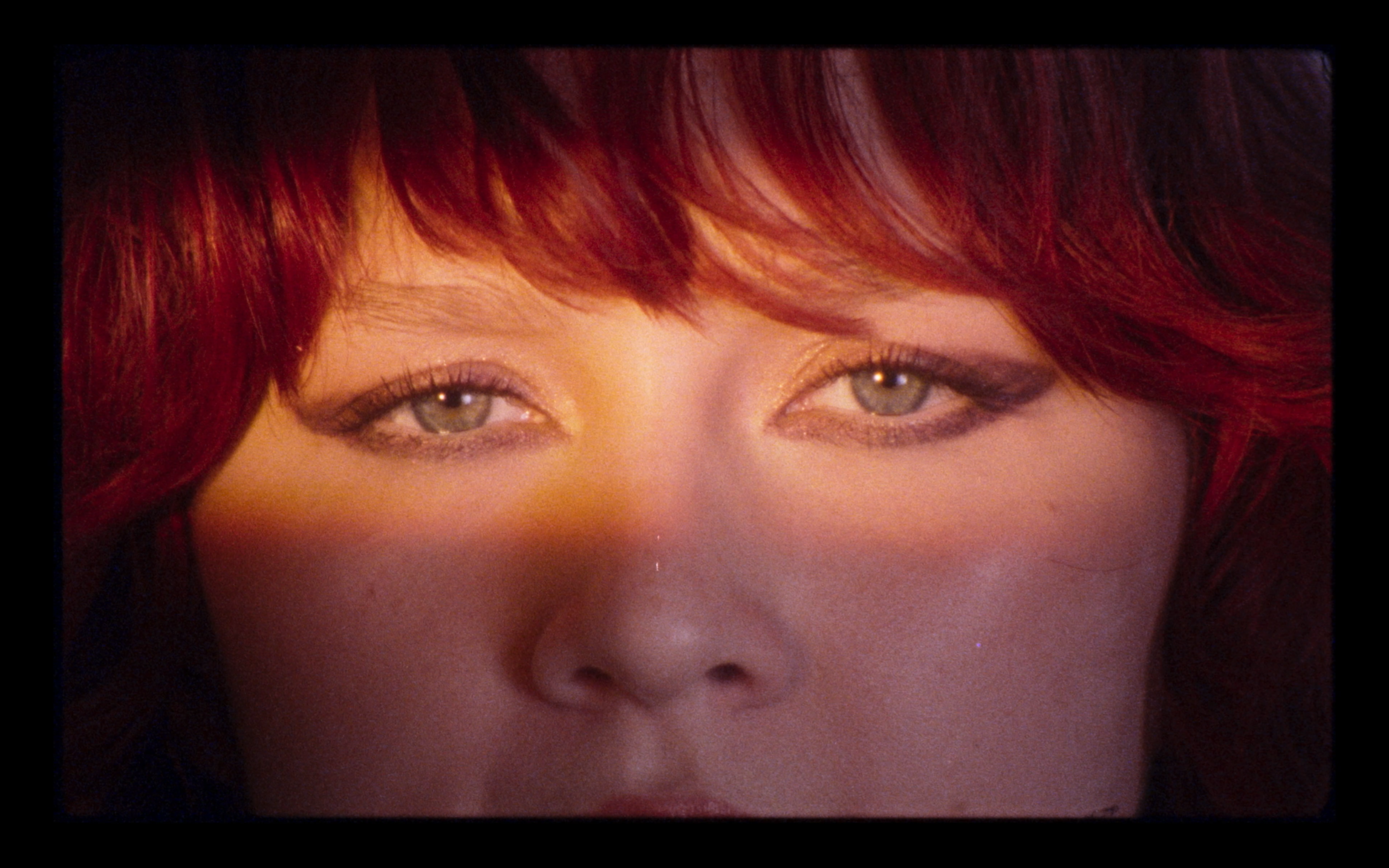 A portrait of Karin Ann in warm light