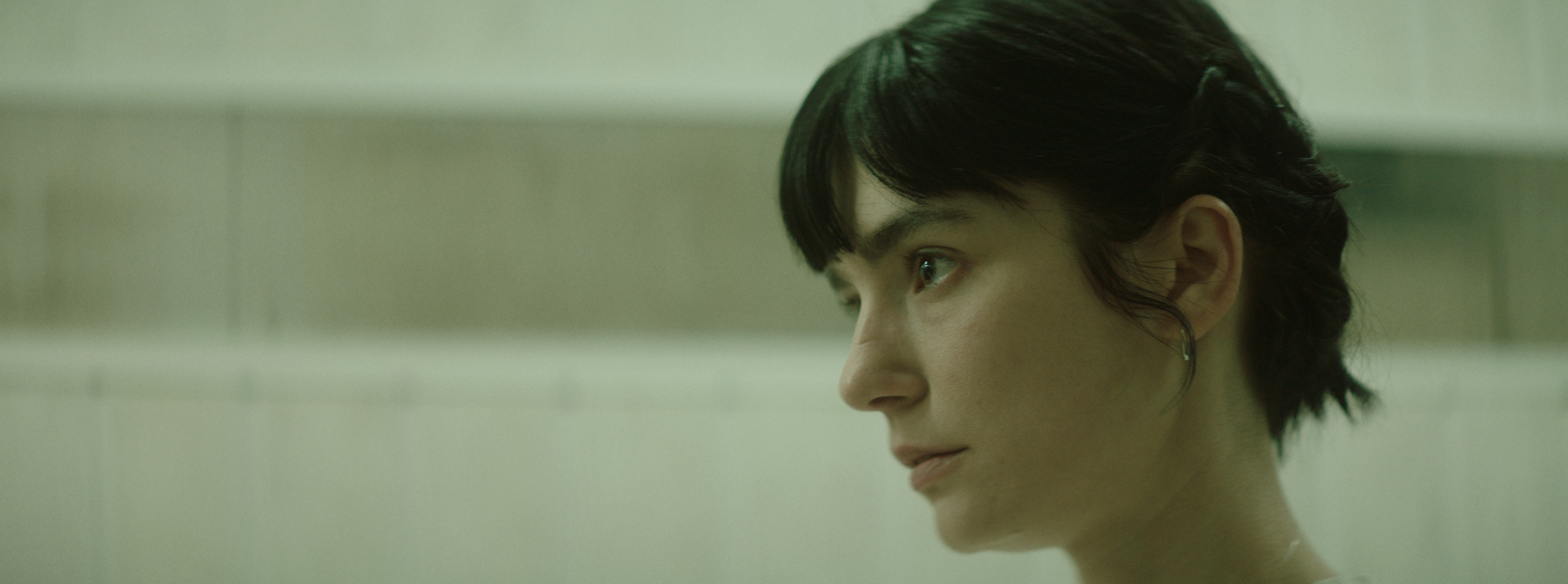 A woman in profile in soft daylight