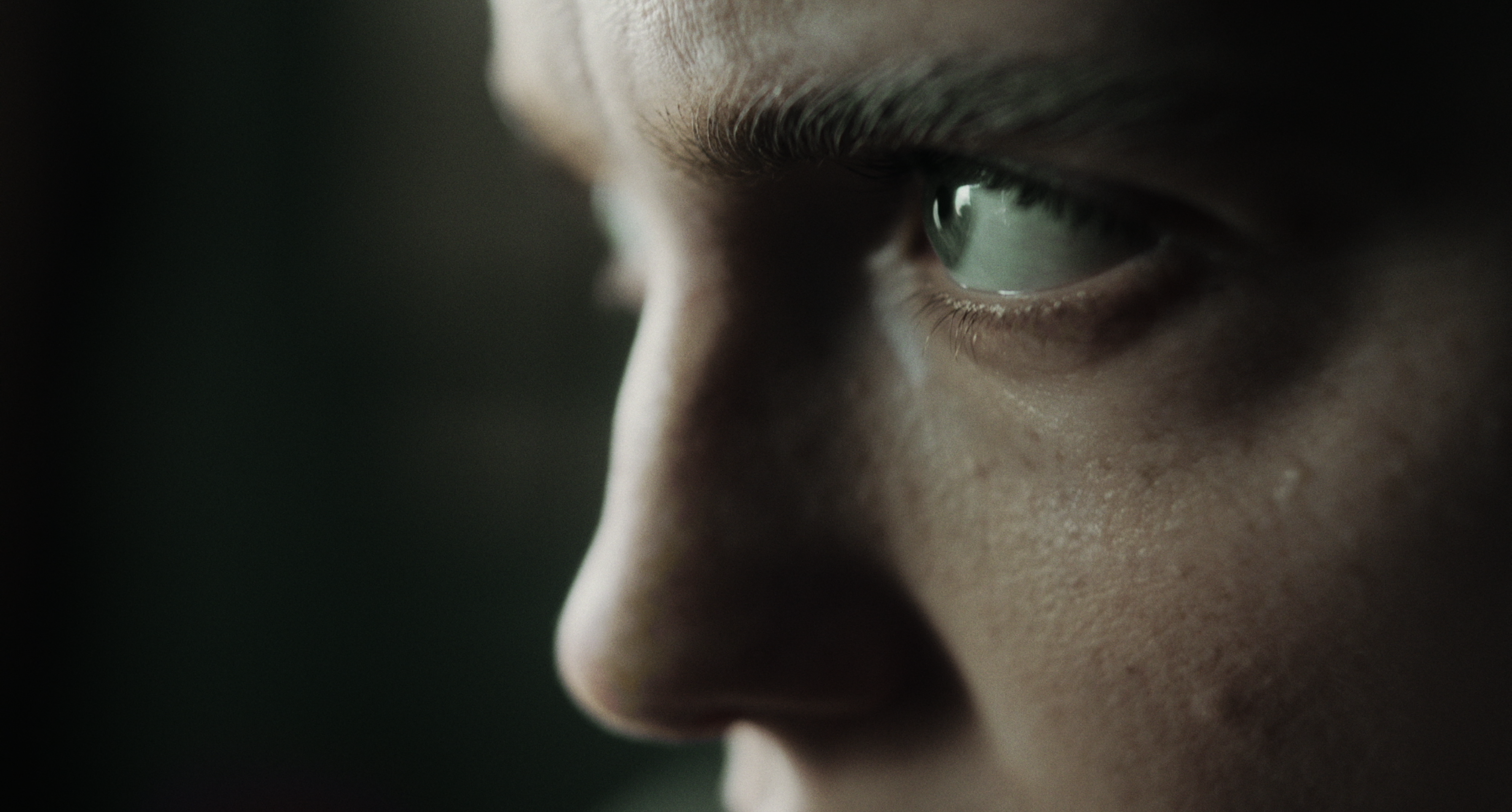 A close-up of a woman’s eye in soft daylight